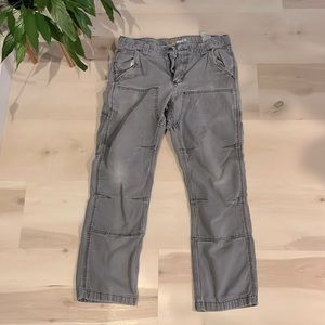 Men’s distressed Carhartt double knee rugged flex pants.